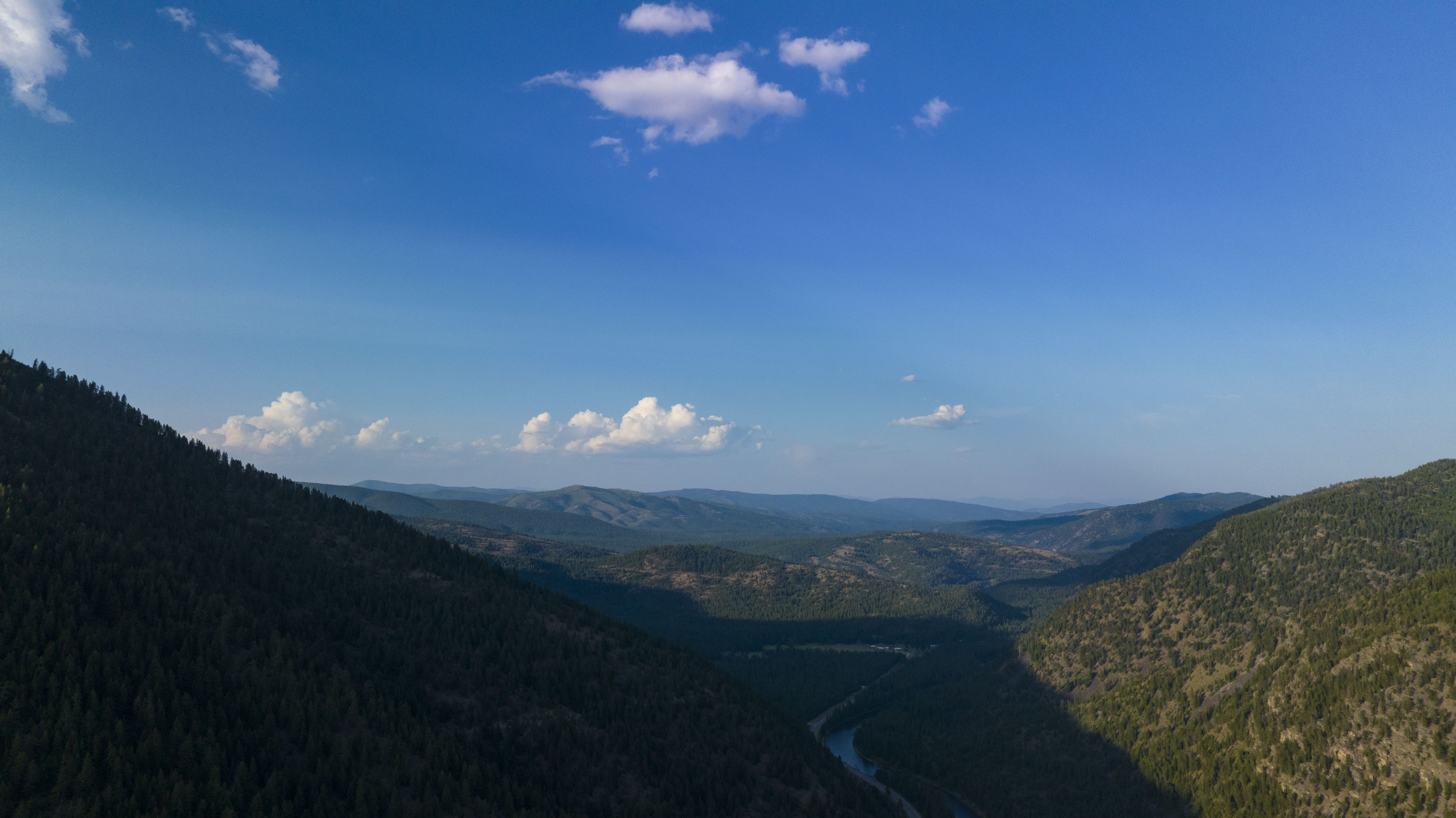 Aerial of the Blackfoot river corridor on a blue sky summer day